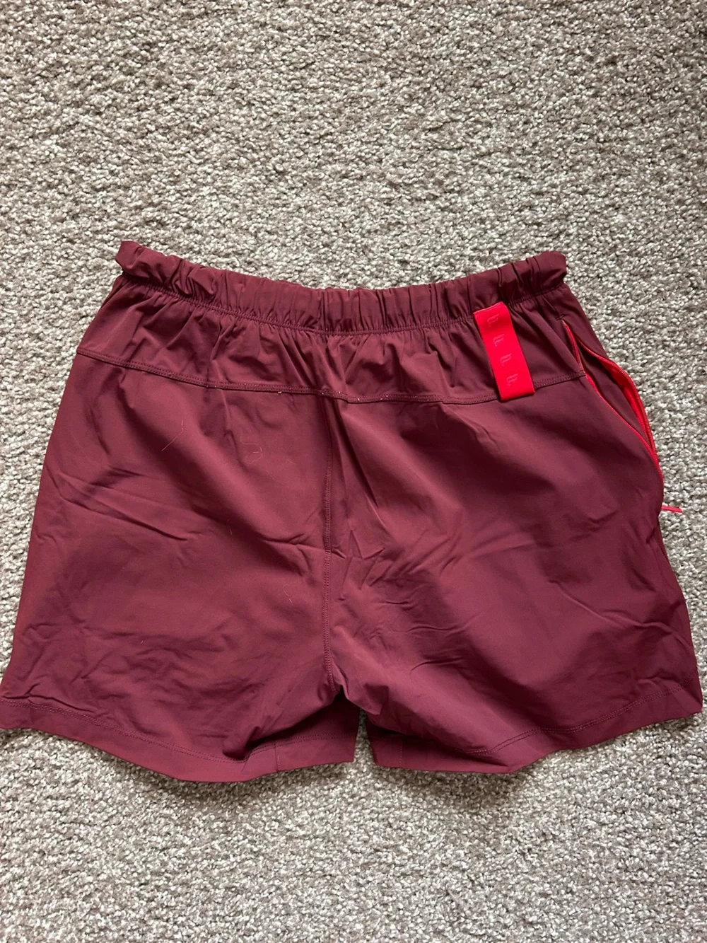Fabletics men’s size XS Maroon Athletic Drawstring lined Shorts with Red Accent